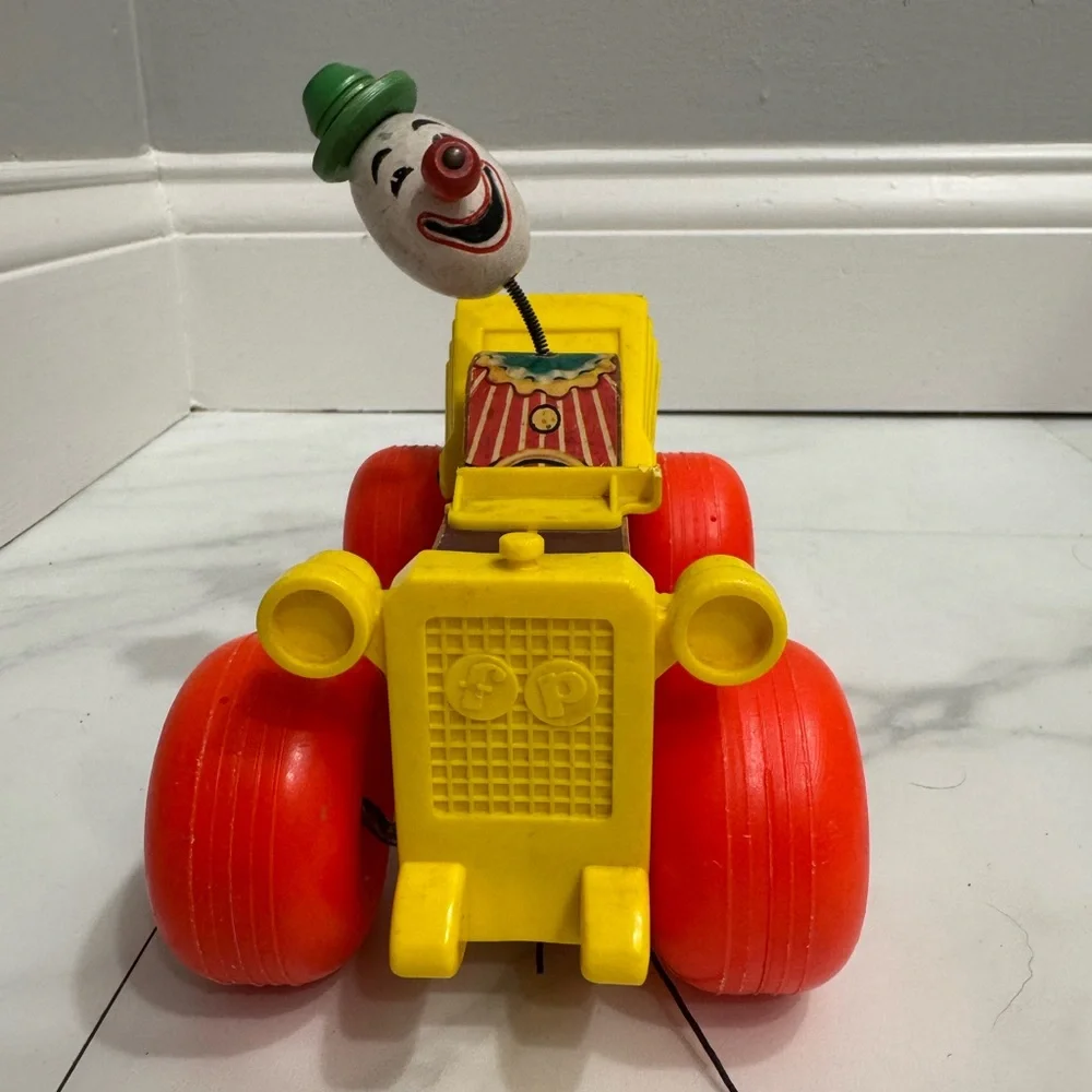 Vintage Fisher Price Jolly Jallopy pull toy from 1974.
